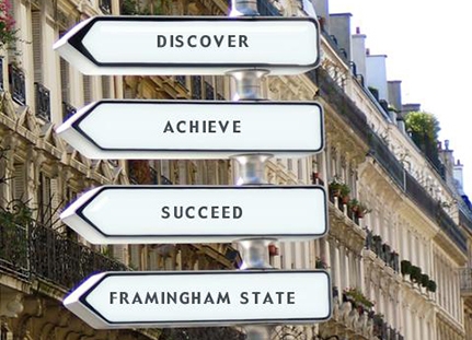 Road signs reading "Discover, Achieve, Succeed, Framingham State".