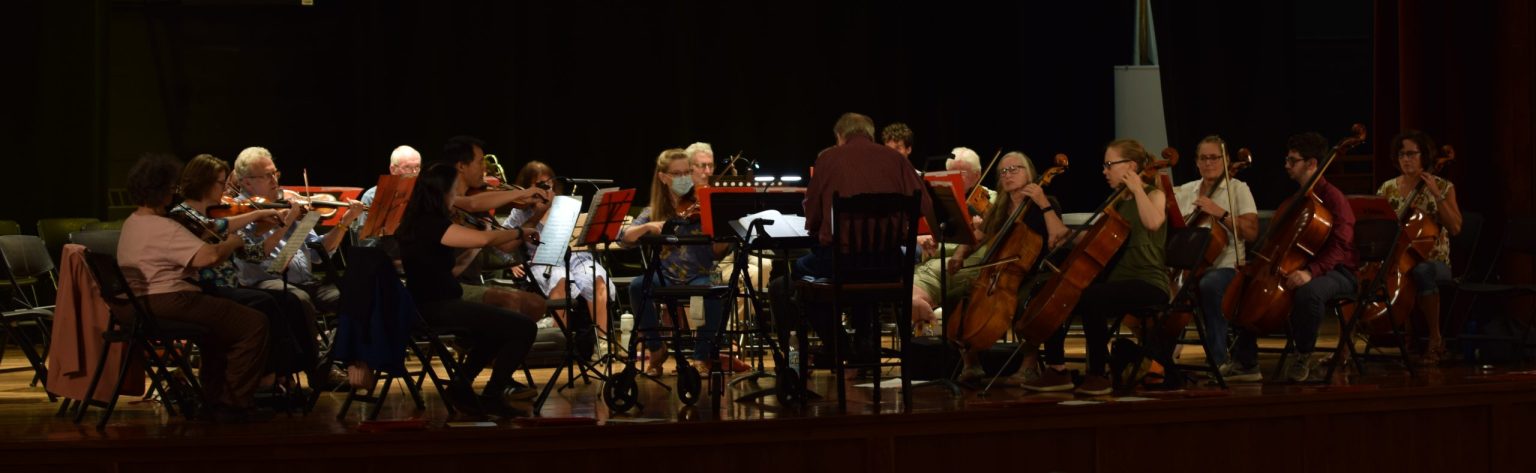The orchestra rehearsing in DPAC