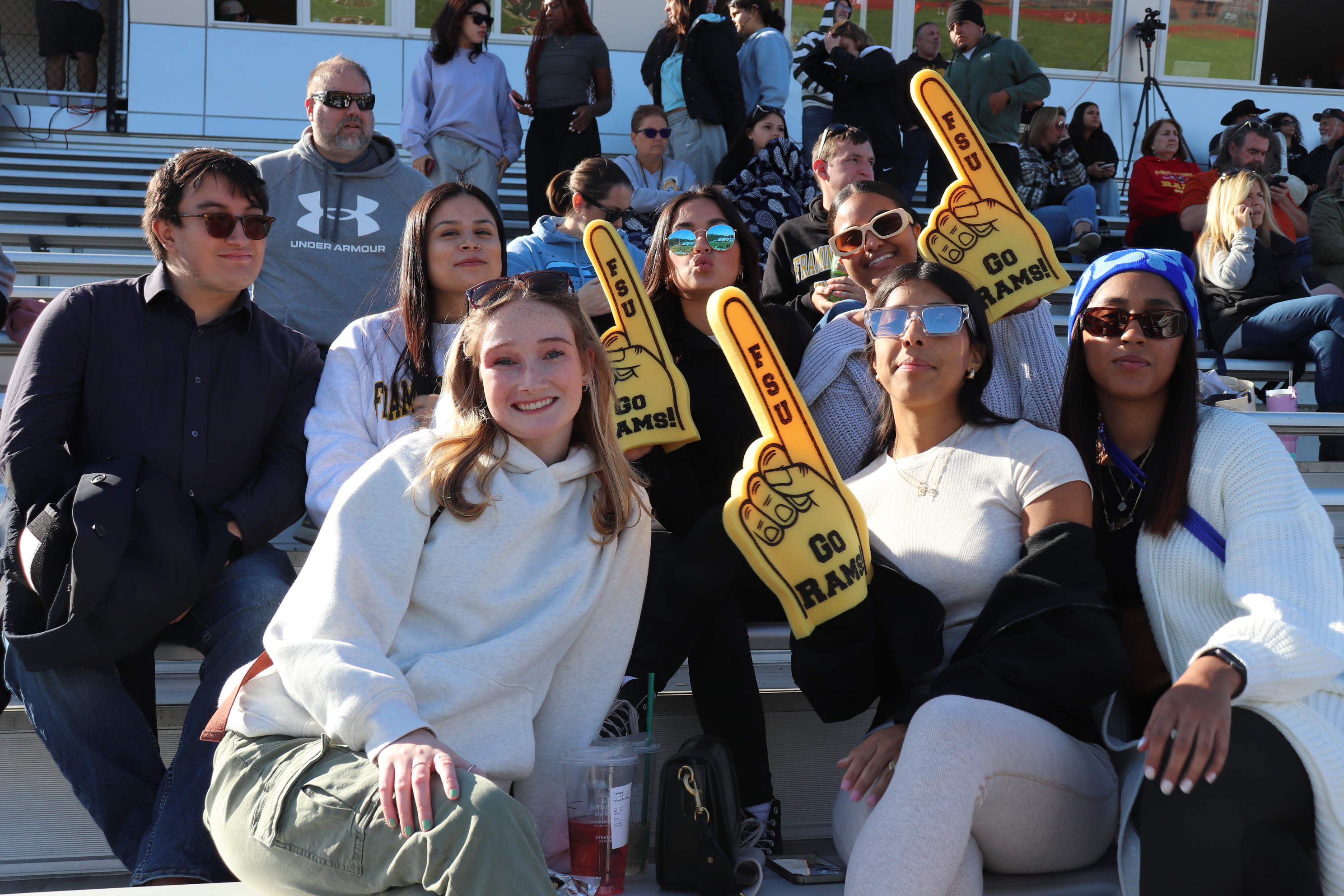 Students in the stands at a football game