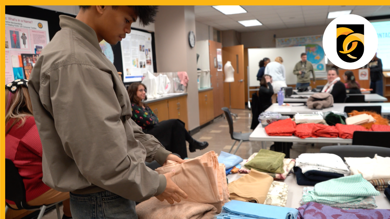 Student at table with fabric