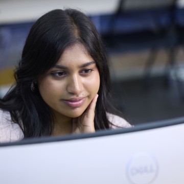 A student looking at a computer screen
