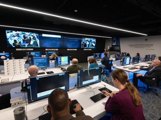 Visitors in the Misson Control Room inside the Christa McAuliffe Center