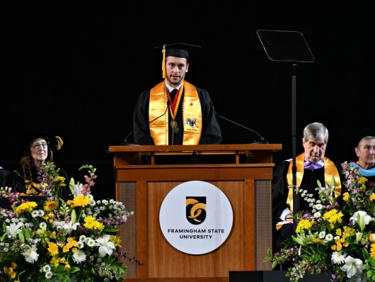 Jeremy McDonald speaking on the state at commencement