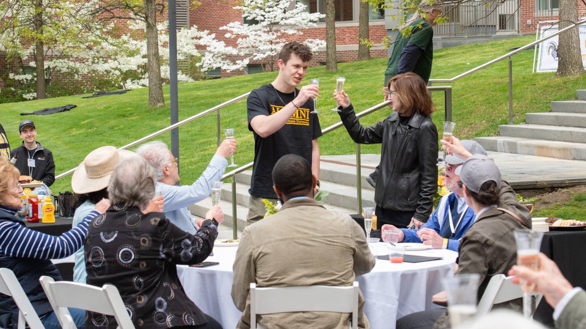 President Nancy Niemi and Class of 2024 grad raise toast