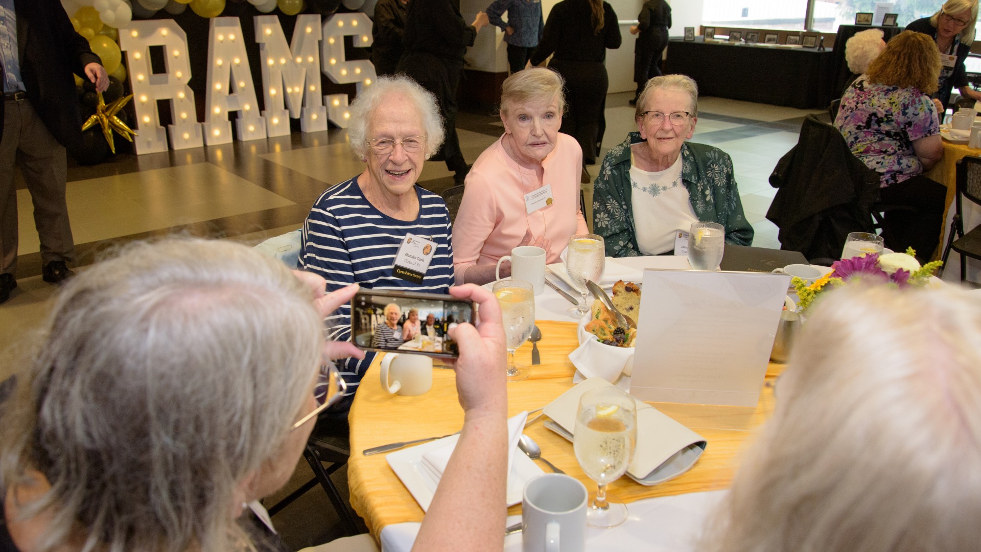 Smiling picture of people at a table