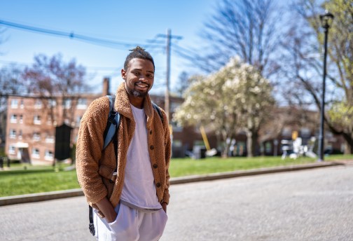 Student posing outside on campus 