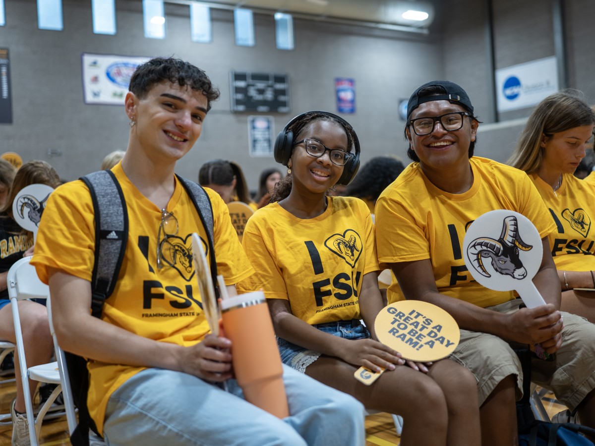 Three students smiling at the New Student Reception 