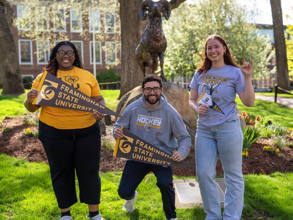 3 Students holding pennants