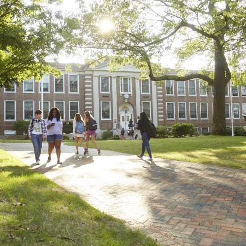 Students walking in the morning in front of Dwight Hall.